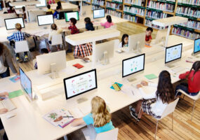 DaaS, Device as a service, Young students using computers in class