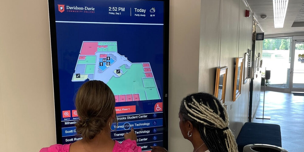 College Students using wayfinding digital signage solution at Davidson-Davie Community College campus