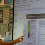 Faculty member at Jamestown, NY school district using an LG CreateBoard in classroom teaching 1000x500