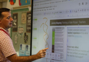 Faculty member at Jamestown, NY school district using an LG CreateBoard in classroom teaching 1000x500