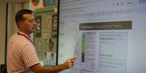 Faculty member at Jamestown, NY school district using an LG CreateBoard in classroom teaching 1000x500