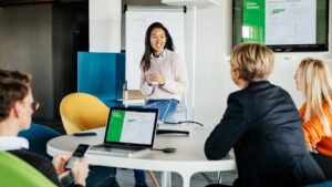 women talking with colleagues in meeting