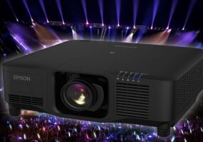 Epson Pro Series projector against a concert backdrop.