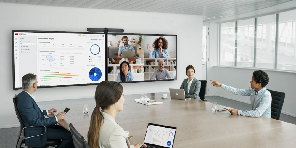Rendering of Barco XMS Cloud Platform in use in a conference room.